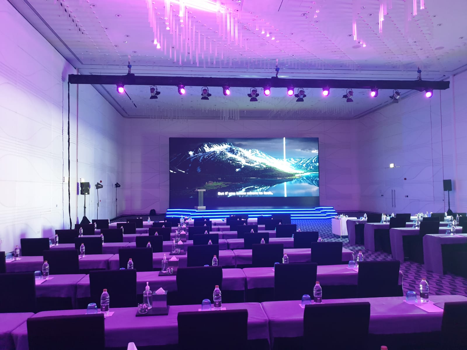 Sophisticated corporate event stage setup by Sonic Media Pro, featuring professional lighting and decor in the UAE.